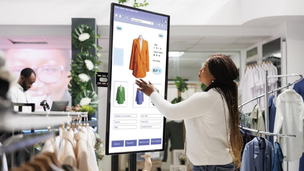 Woman buyer selecting clothes on board